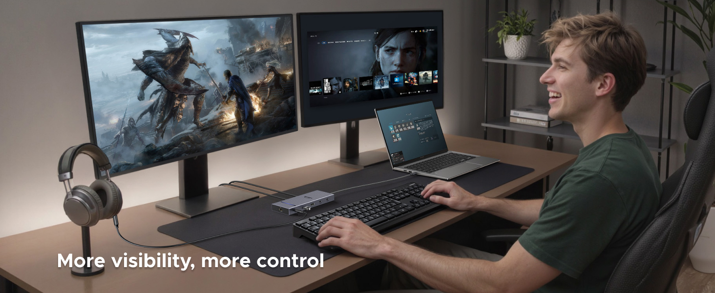 Dual-monitor gaming setup with large curved display and smaller secondary screen. User operates a laptop and keyboard on wooden desk. Headphones visible. Text reads 'More visibility, more control'.