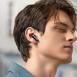 a man wearing a bluetooth earbuds