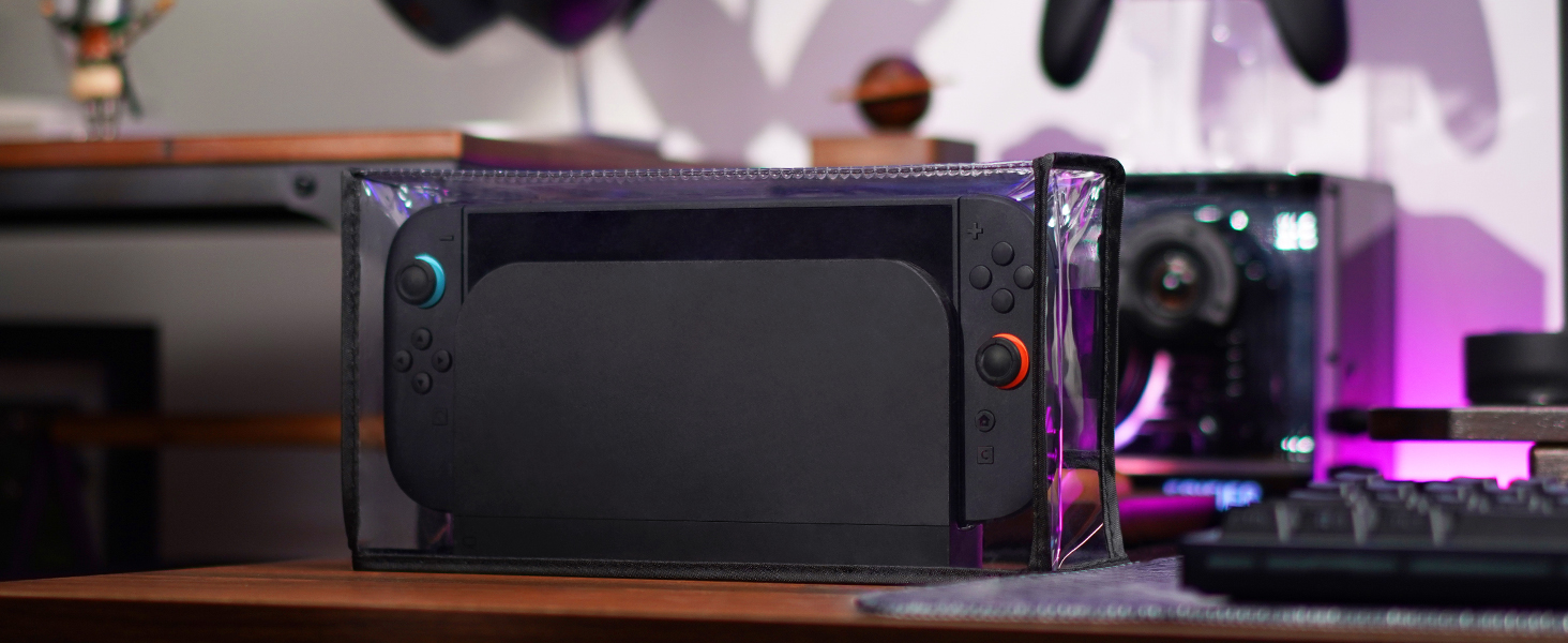 Haut-parleur portable ou appareil audio noir affiché sur un fond teinté de violet avec des effets de lumière.