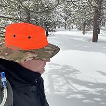 boonie hat worn by man in snowy forrest
