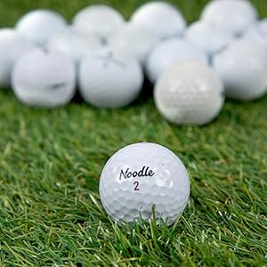 Noodle Golf Balls on Green Turf grass