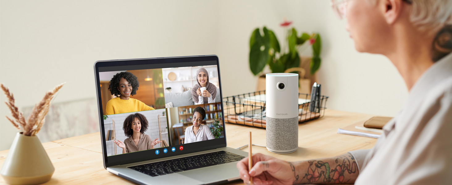 a person using a laptop and a speaker
