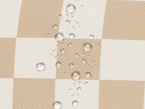 Close-up of a beige and white checkered fabric with water droplets on the surface, demonstrating water-resistant properties.