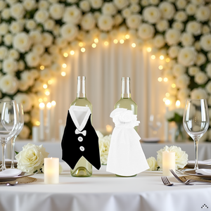 A rustic wooden table with a bottle of wine and two wine glasses, surrounded by rose petals and a de