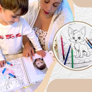 mother and child writing in a baby book and coloring in some pages and adding a baby photo