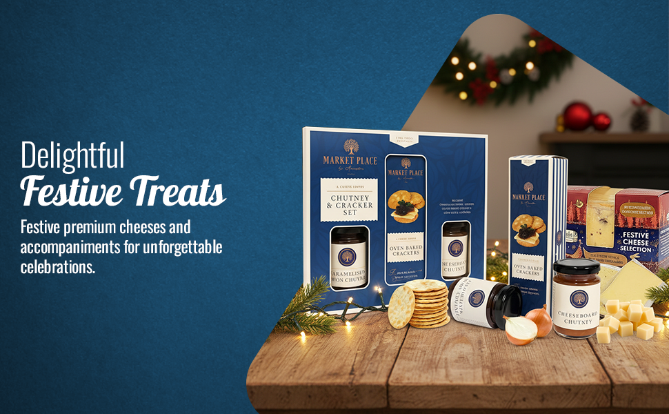 Text reads 'Delightful Festive Treats'. Product display featuring multiple gift boxes and packages arranged with decorative lighting on dark wooden surface.