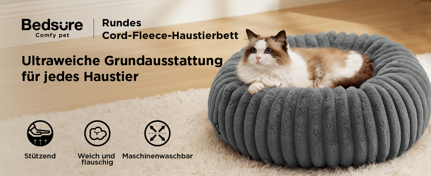 Der Text lautet „Bedsure“, „Bundes“, „Ultraweiche Grundausstattung“, „Cord-Fleece-Haustierbett“. Graues rundes Haustierbett mit gerippter Struktur im Cord-Stil, das verschiedene Produktmerkmale aufweist.