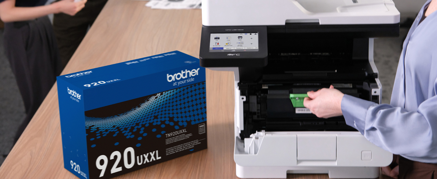 Person inserting Brother Genuine TN920UXXL ultra high-yield toner in MFC-L5915DW laser printer
