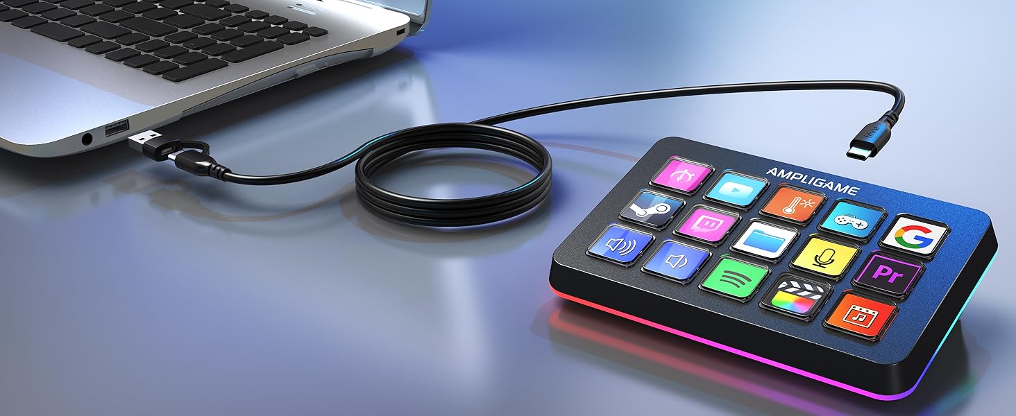 Compact device with colorful app icons connected to laptop via cable. Features touchscreen interface and circular accessory, likely for creative digital tasks.