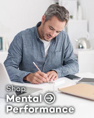 Man in gray shirt writing at a desk with papers and laptop visible. Text overlay reads 'Shop Mental Performance'.
