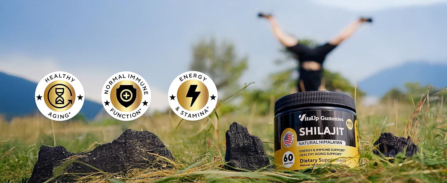 Shilajit gummies jar in grass and man in black shorts doing hands-stand on the background