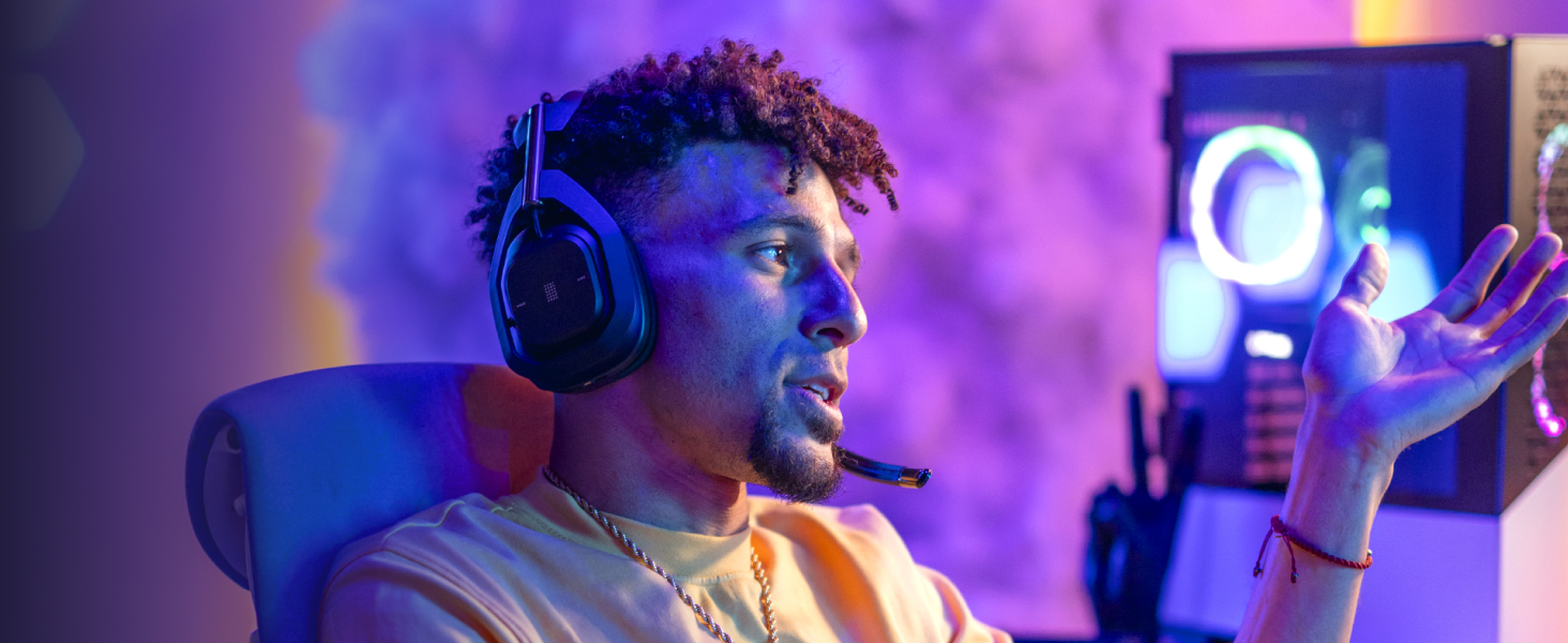 a man wearing a50 x lightspeed wireless gaming white headset