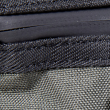 water-resistant fabric and zipper detail on the Omerta Capo Locking Carbon Filter Pouch in Green