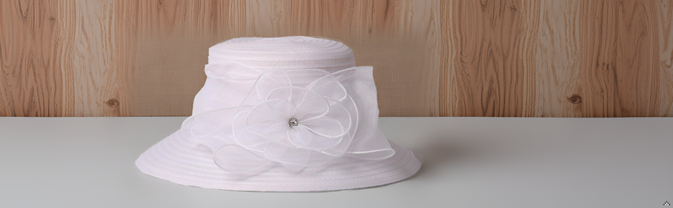 A stylish product displayed on a wooden table with a vase of fresh flowers.