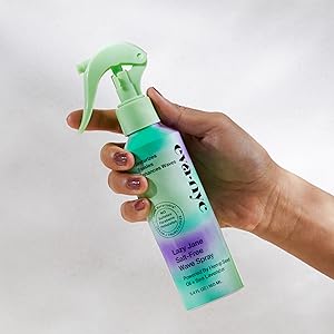 hand holding lazy jane wave spray bottle