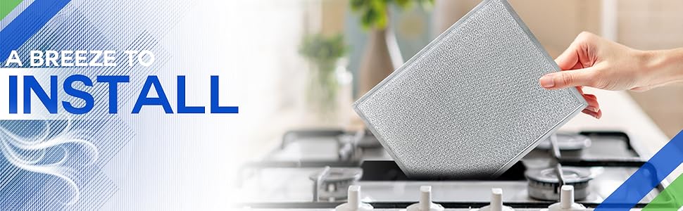 A downdraft stove filter being inserted into a downdraft oven