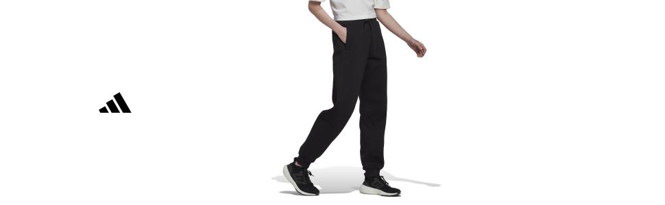 Athletic wear product photo showing black pants with Adidas logo visible against white background.