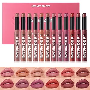 Text reads 'VELVET MATTE'. Display of lipstick collection showing multiple shades arranged in rows against pink background, featuring various nude and pink tones.