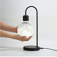 Hold the magnetic moon about 3 inches below the hanger.