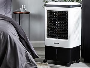 Multiple views of white cube electronic device from different angles on dark background.