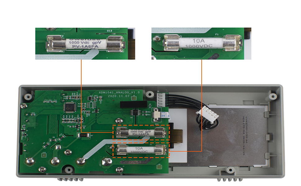 Open electronic device showing circuit board, wiring, and fuses. Two detailed images of fuses are shown above the main unit.