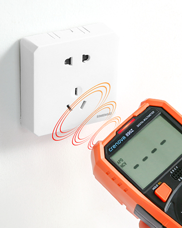 Orange handheld device with digital display near a wall outlet. Illustration shows wireless signal between device and outlet.