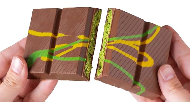 dubai chocolate broken to two pieces filled with pistachio cream and kataifi