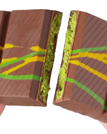 dubai chocolate broken to two pieces filled with pistachio cream and kataifi