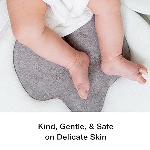 Close up of baby legs on the baby bath pad for sink to demonstrate softness and delicacy