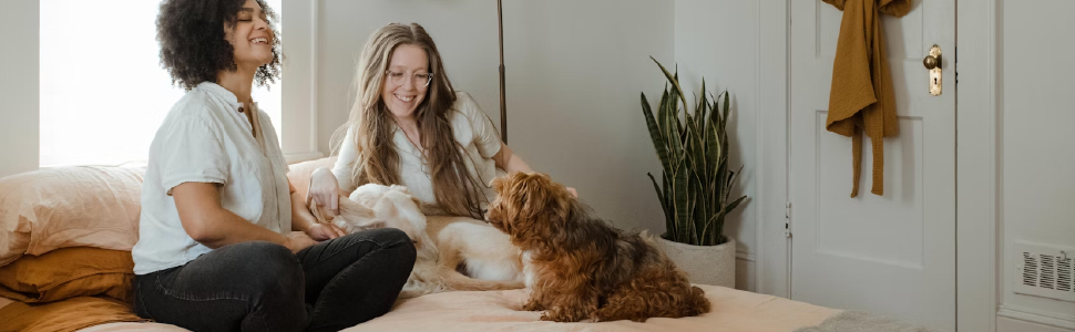 two women with two dogs