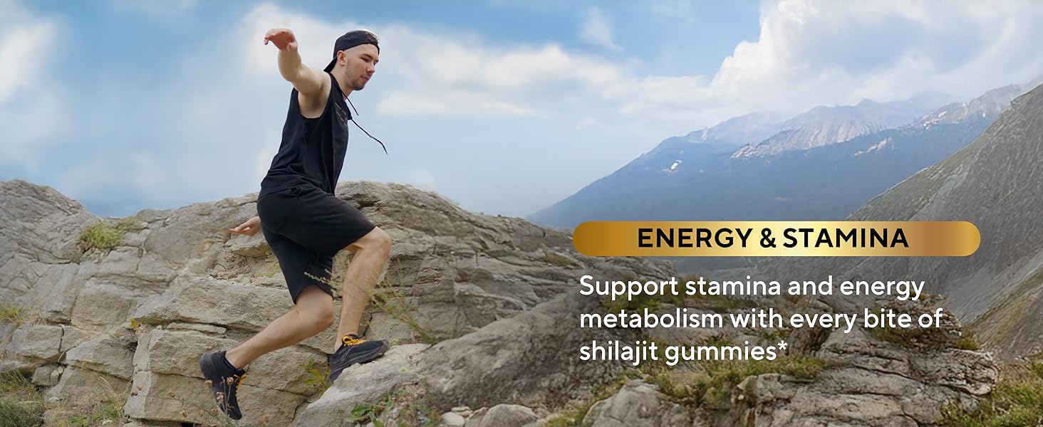 man in black vest and shorts hops beetween rocks on mountain with energy and stamina text