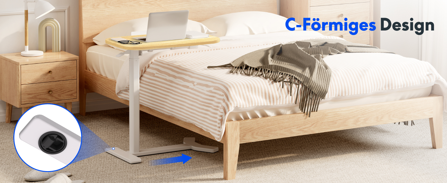 Der verstellbare Oberbetttisch mit C-förmiger Basis lässt sich unter das Bett schieben. Die weiße Tischplatte bietet Platz für den Laptop. Bettgestell und Nachttisch aus Holz sind sichtbar. Auf der Abbildung ist das Rad des Tisches abgebildet, das für mehr Mobilität sorgt