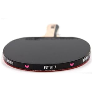 de la marca Butterfly con superficie negra y borde rojo, mostrada desde arriba sobre fondo blanco.