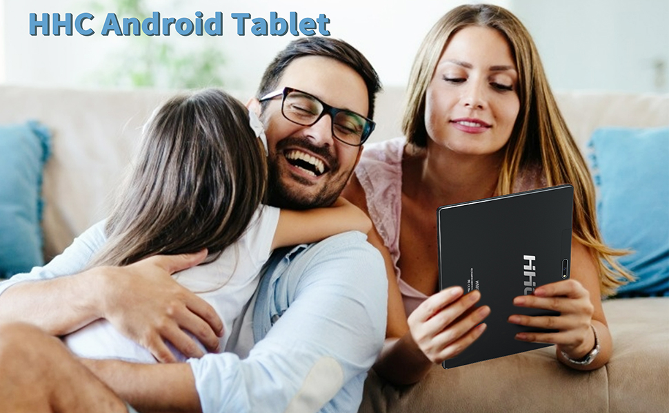 A family sitting on the sofa and watching the tablet