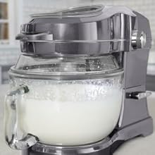 Picture of the Kenmore Ovation stand mixer with 5 qt glass mixing bowl filled with whipped cream