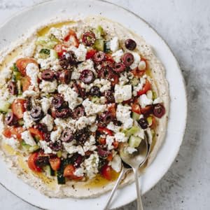 GREEK 7-LAYER HUMMUS DIP on a plate.