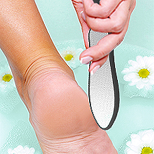 Use the coarse side to file the rough areas of your feet.