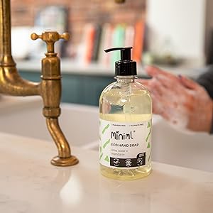 person washing their hands with Miniml lime basil mandarin hand soap 500ml bottle pump 