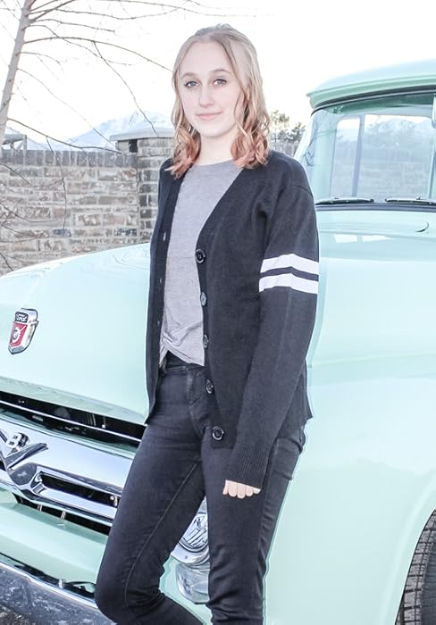 women wearing letterman sweater