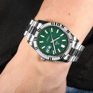the green dial of the rolex sea - dweller.