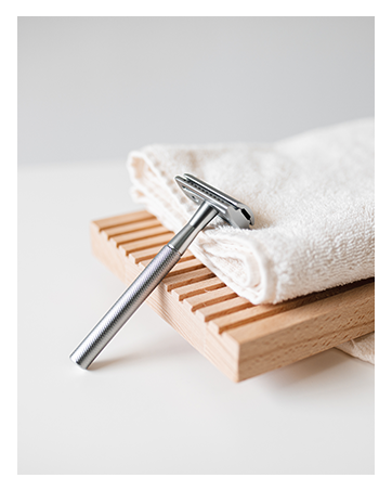 Shaving Razor Leaning On Towel