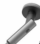 Primer plano de un dispositivo plateado cilíndrico con una base redonda y un vástago en ángulo, con un pequeño botón o sensor en el