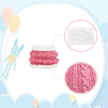 Pink knitted or crocheted items including a circular piece and a folded garment, with toothbrush and soap dish in background.