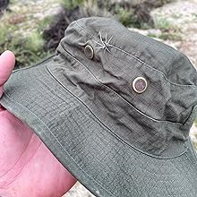 Green boonie with thorns in it