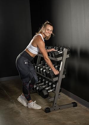 Female smiling dumbbell rack