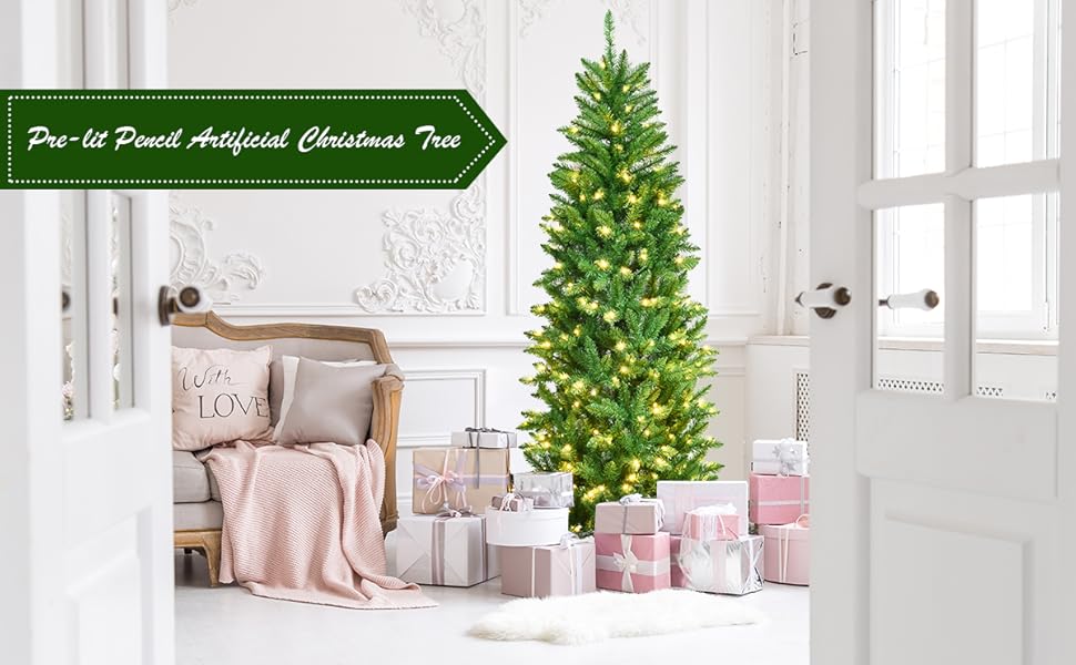 Artificial Christmas tree with pre-lit warm white LED lights, displayed in a bright room with wrapped gifts and holiday decor surrounding it.