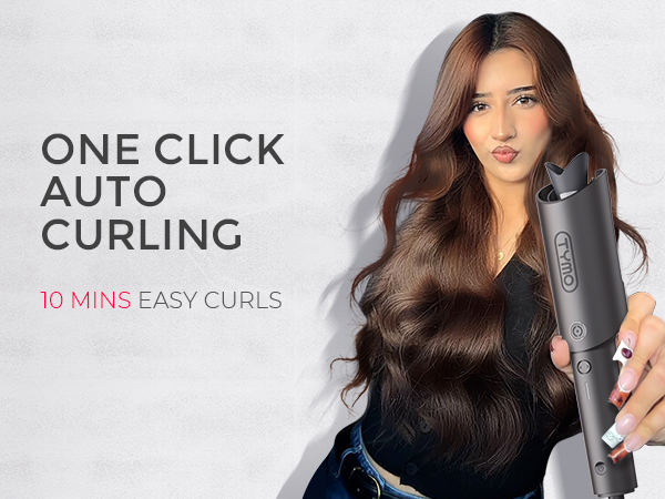 Automatic hair curling device with text '10 MINS EASY CURLS'. Gray cylindrical tool held by a hand, demonstrating use on long, dark hair.