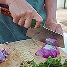 Many chopping and prepping food with knife and ergonomic knife grip attached