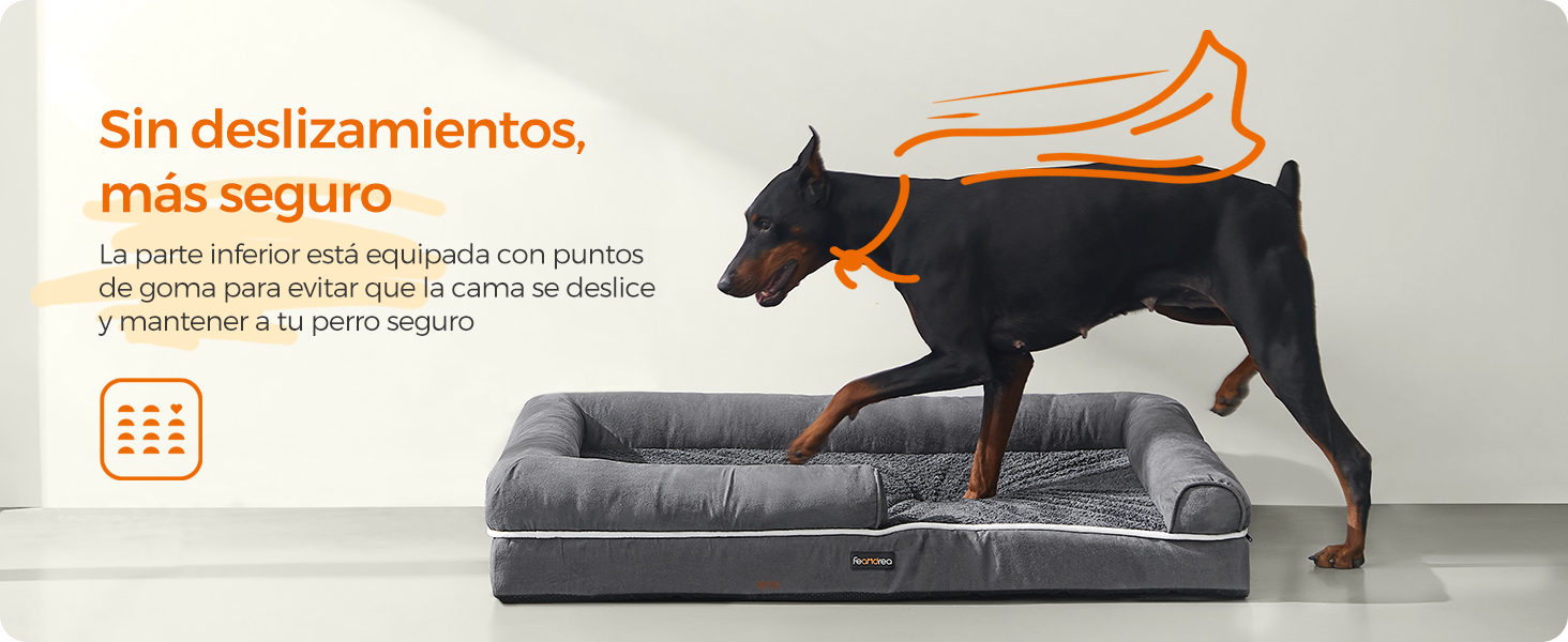 perro doberman pinscher en una cama para perros