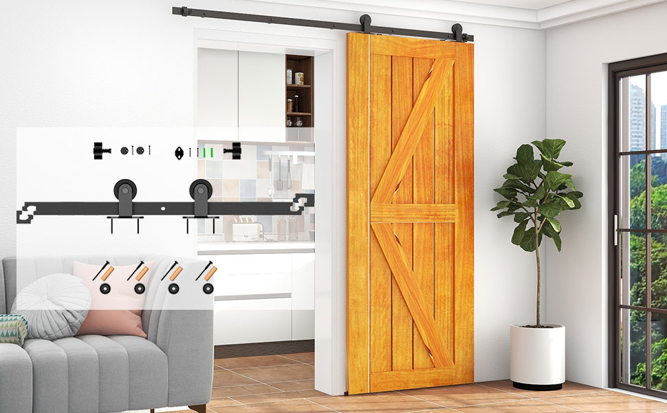 Modern interior with wooden sliding barn door, gray sofa, white kitchen, and large window. Black text 'SOFT TOCH' with feather icon visible.